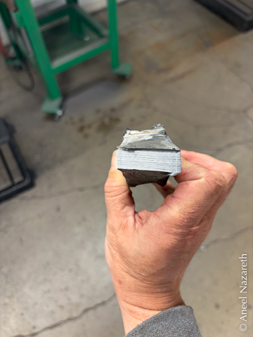 The end of the cross peen has been cut off, showing a crooked saw-cut face